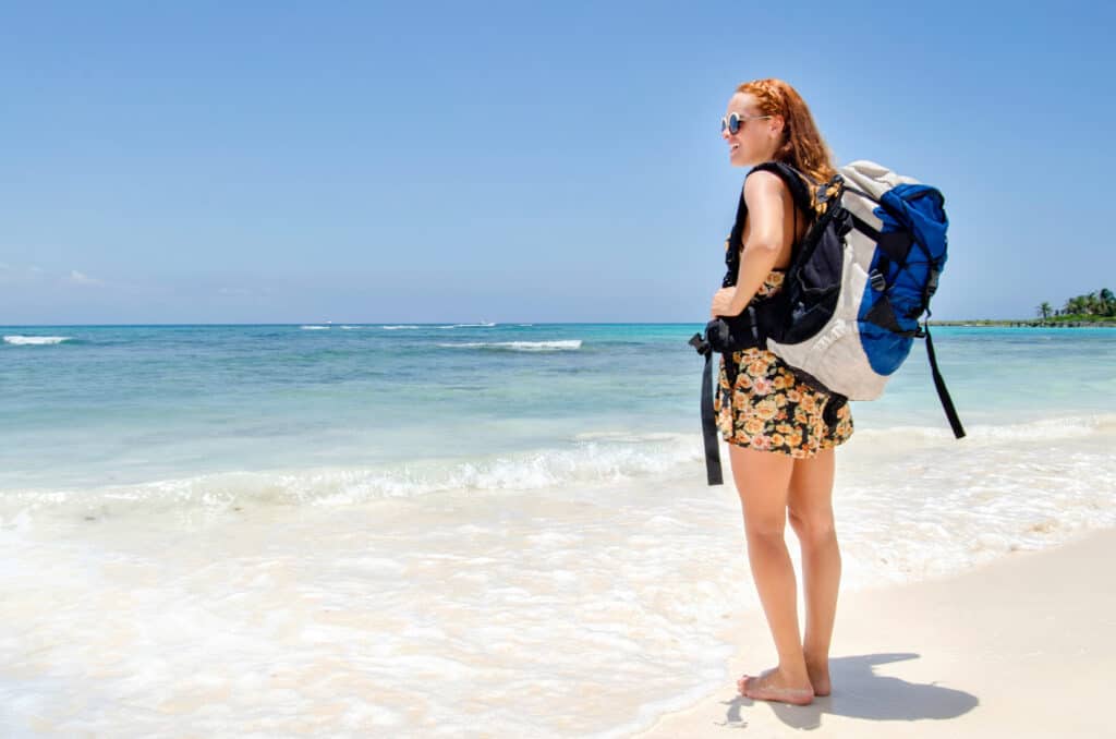 Backpacker girl at beach