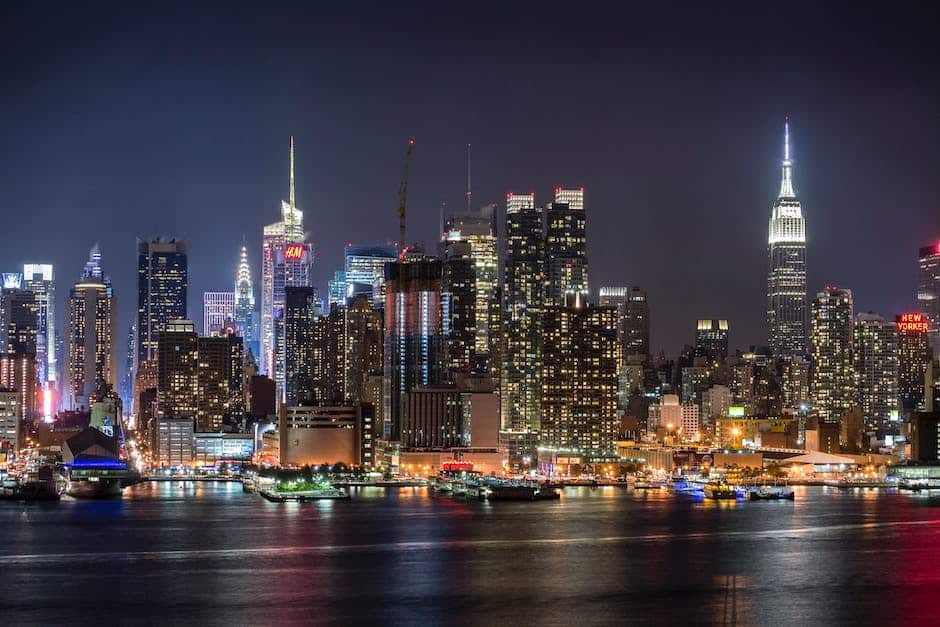 A view of the new york city skyline at night.