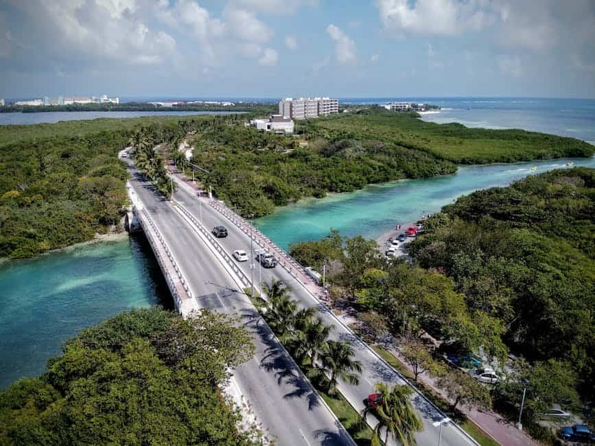 An aerial view of a bridge over a body of water.