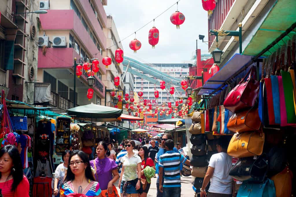 A crowd of people walking down a street.